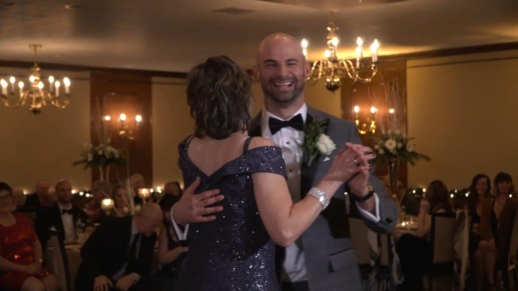 Mom and son dance at century house