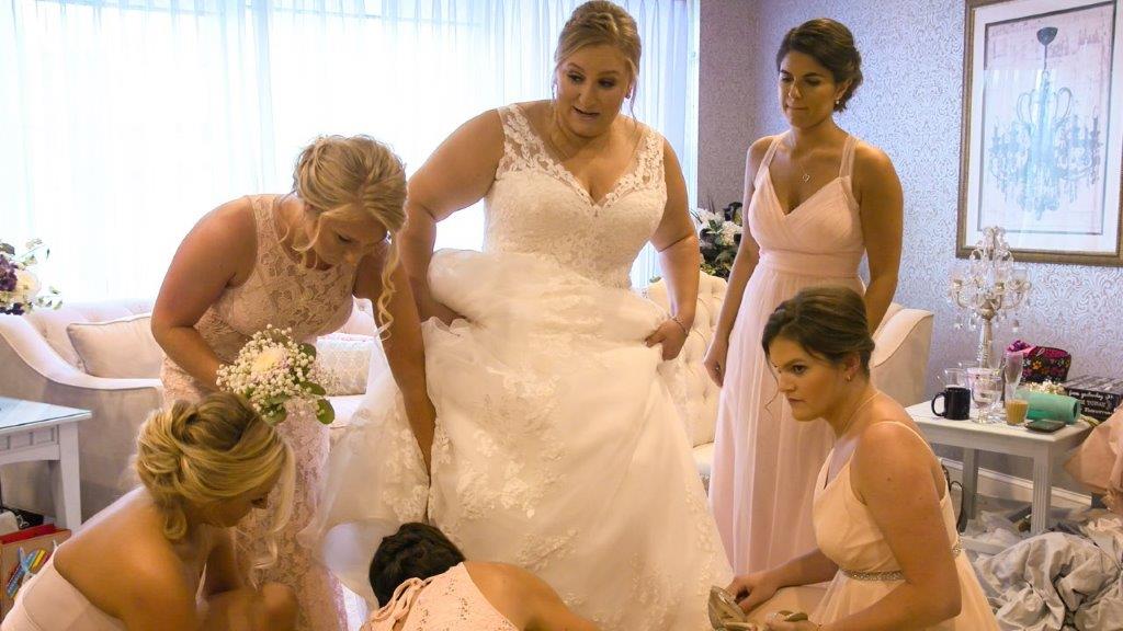 Normanside bridesmaids helping with shoes-2